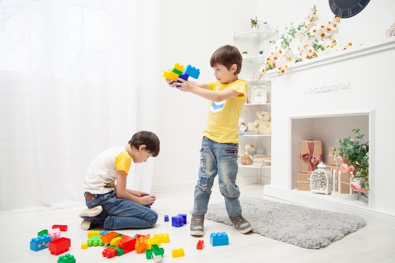 Soft Play vs Plastic or Wood Play Equipment: Which Should You Buy? 2 Colourful play blocks arranged for toddler play